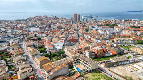 Beautiful aerial view of Costa-style coastal architecture in the picturesque town of the Mediterranean seashore.