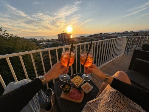 Sunset cocktails on terrace at Versilia Panoramic Luxury, Como, with Tyrrhenian Sea and Apuan Alps views