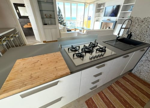Modern luxury apartment kitchen in Como with panoramic views of Tyrrhenian Sea and Apuan Alps