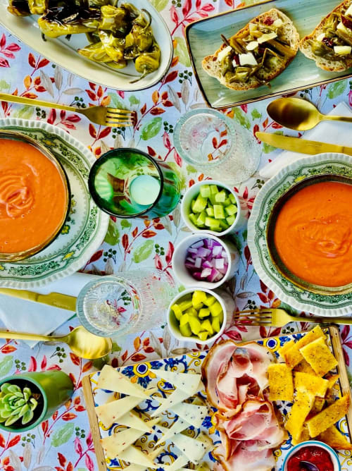 Colorful Spanish gazpacho spread at Agriturismo CasaViva with fresh vegetables, cured meats, cheese, and toasted bread