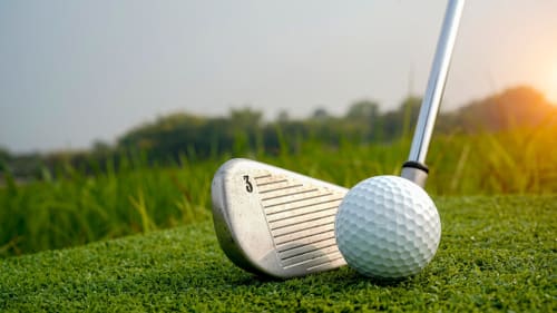 Golf club and ball on green fairway at Casa Sibarita, Rafelguaraf resort