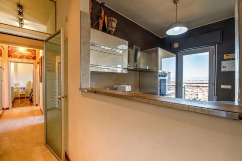 Modern kitchen with city view in Roby's Panoramic House apartment, Livorno Italy