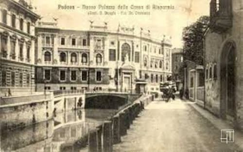 Historic Padova street with palazzo buildings and canal, city view from Hometoday apartment