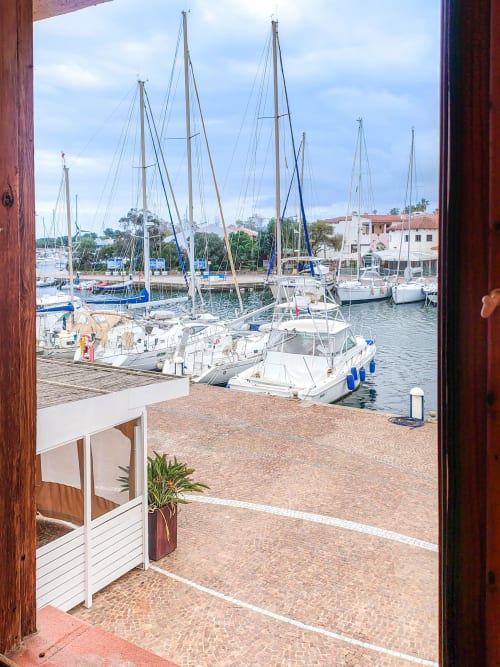 Marina view from Dolce Sardinia apartment at Vesta Home Rent, Padova with sailboats and waterfront