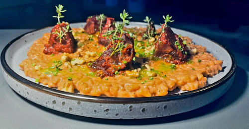 Gourmet risotto with seared meat and microgreens at Clos De La Gourmandiere, Saint-Lothain