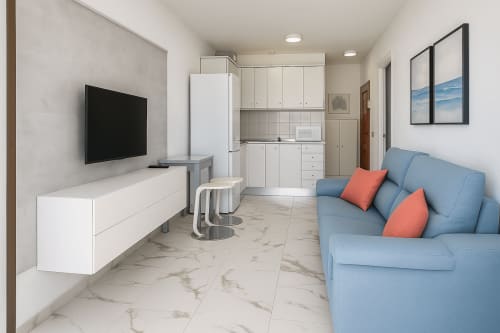 Estúdio moderno em Apartamentos Gelimar, Porto Rico com sofá azul, kitchenette, rack TV branco e piso em mármore