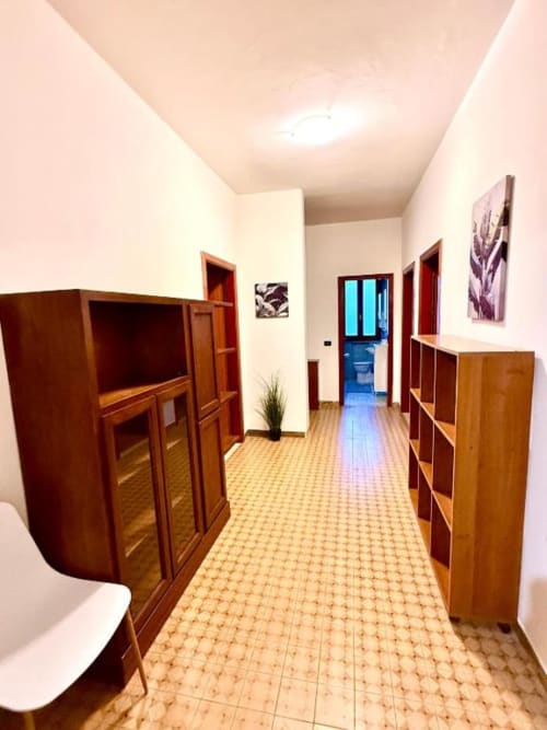 Hallway in Appartamento Chiara at Hotel Il Mulino, Villalunga, with wooden furniture and terracotta flooring