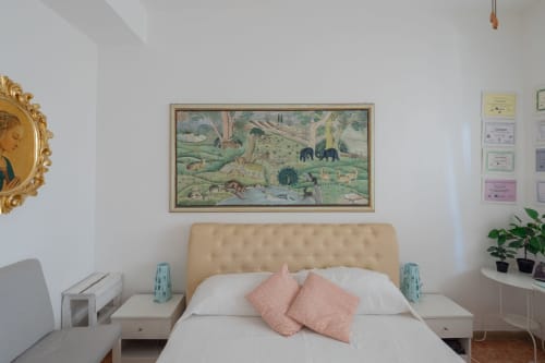 Stella Polare Luxury bedroom in Rome Sensorial Rooms, Ostia: cream headboard bed with pink pillows, vintage wildlife art, and