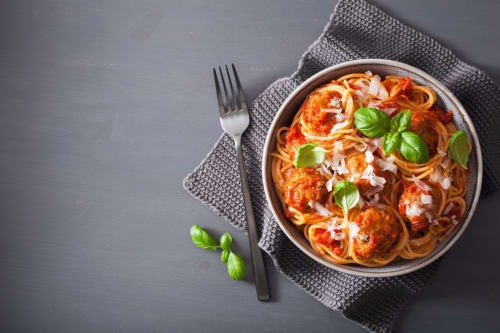 Plate of spaghetti with tomato sauce and basil at LH51 Rooms and Apartments, Italy