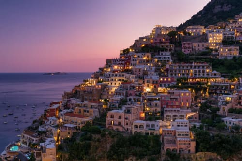 Positano village at twilight, colorful buildings cascading down cliffside to Mediterranean Sea, LH51 Rooms location