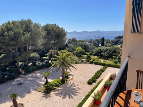 Balcony view of Mediterranean gardens and sea at Résidence Le Château Du Parc, Saint Raphaël