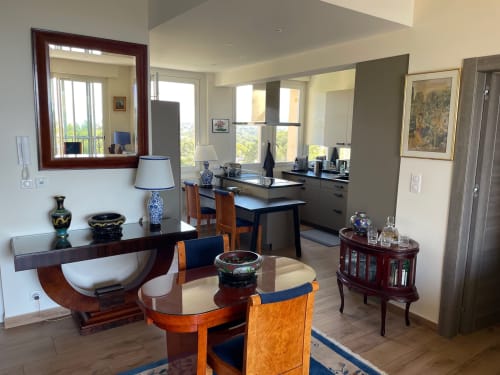 Elegant apartment living room with dining area, sea view windows, and classic furnishings at Résidence Le Château Du Parc,