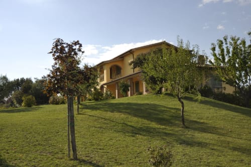 Agriturismo Buriano countryside villa in Lubriano with manicured gardens and rolling green hills