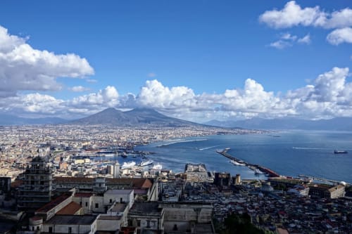 Mount Vesuvius overlooks Naples cityscape with bay and harbor from LH51 Rooms and Apartments