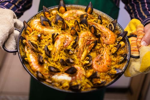 Traditional paella with seafood and mussels served at Casa Rural Finca El Olivar in Las Cuevas, Spain