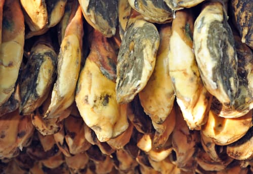 Cured jamón ibérico hanging in Trevélez, Granada - traditional Spanish ham production at Hotel Mulhacén