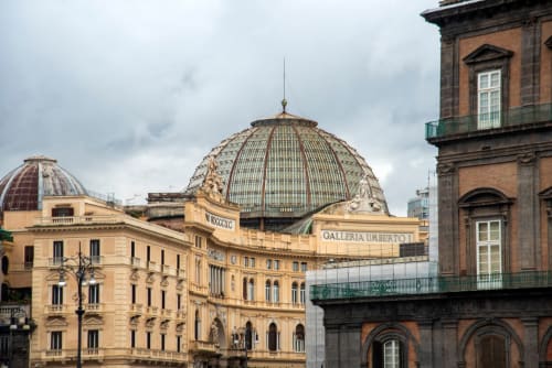 Historic Naples architecture featuring ornate domed buildings and classical facades near Dreams & Colors B&B