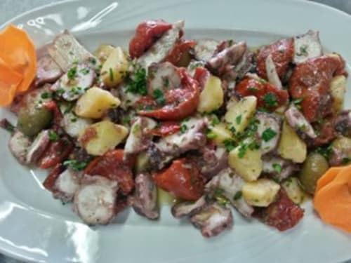 Grilled meat and potato skewers with fresh herbs at Hotel Ristorante Domu Incantada in Muravera