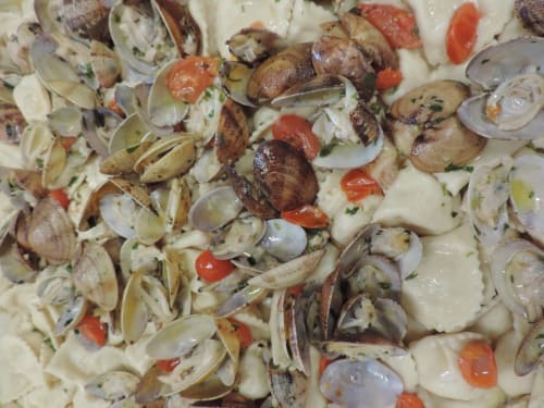 Fresh clams and seafood dish at Hotel Ristorante Domu Incantada in Muravera, Italy