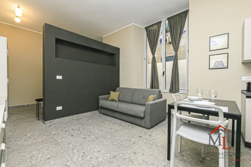 Moderno monolocale nel Centro Storico di Genova con divano letto, zona pranzo e vista sulla città