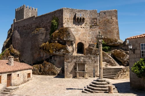 Medieval stone castle fortress at Moinho do Maneio guesthouse in Penamacor, Portugal, with courtyard and historic