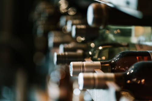 Wine bottles with labels displayed at Casa Rural Finca El Olivar in Las Cuevas