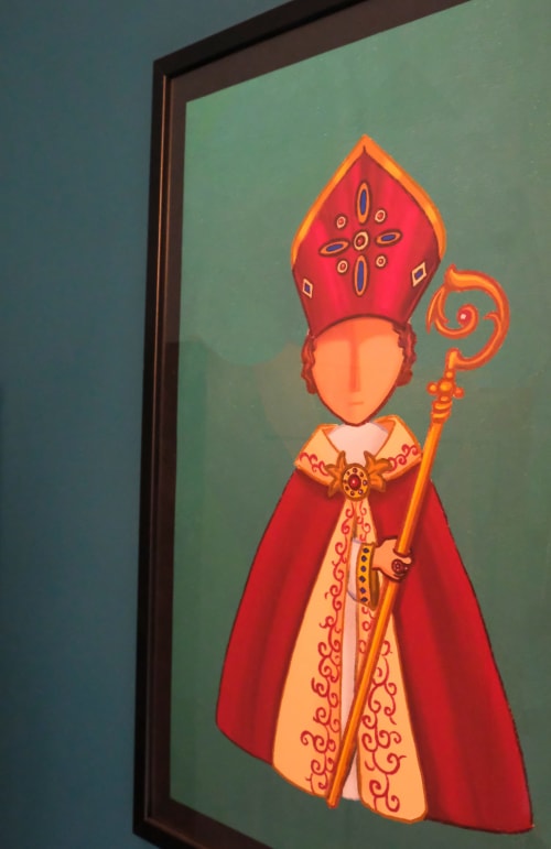 Ornate religious figure in red and gold robes with decorative staff, artwork in Vesuvio's Room at LH51 Napoli