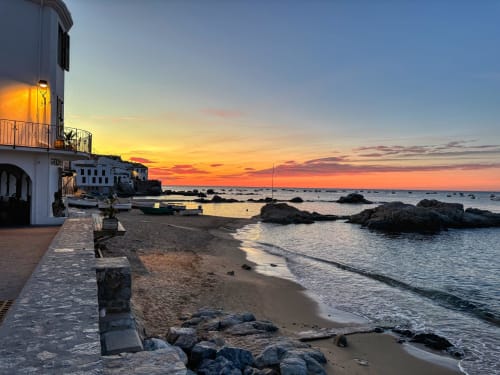 Sunset over Mediterranean beach at Finques Garcia Enrich hotel in Palafrugell, Spain