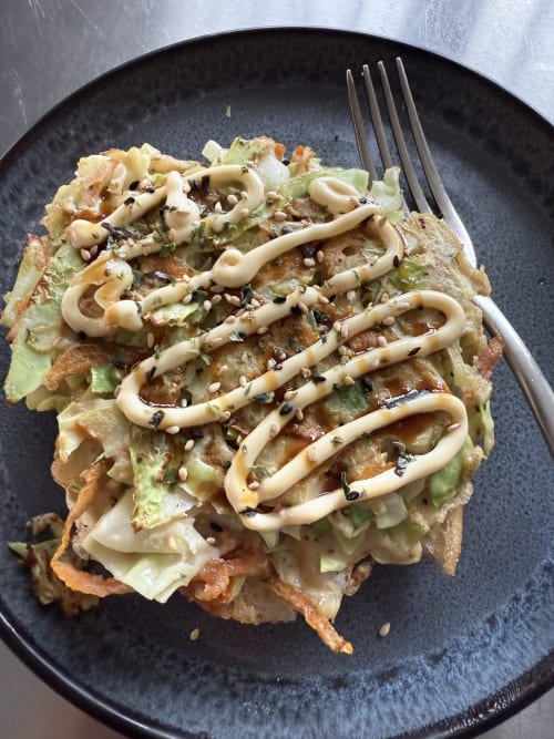 Gourmet toast with cabbage, crispy sauce drizzle, and sesame seeds at Golden Mermaid Villa, Ribeirinha
