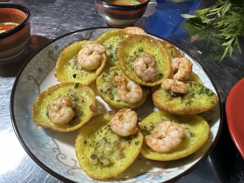 Shrimp-topped avocado toast at Golden Mermaid Villa, Ribeirinha Portugal. Fresh seafood appetizer with herbs.