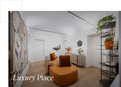 Suite di lusso moderno a Palazzo Garibaldi Parma con sedute arancioni, piante e arredamento minimalista