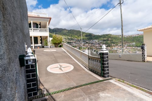 Hilltop terrace at Azul Infinito Casa in Arco da Calheta with panoramic views, white villa, and modern amenities