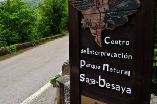 Wooden sign for Centro de Interpretación Parque Natural Saja-Besaya at Posada La Colodra in Los Tojos, Spain