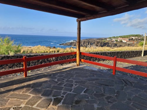 Red-railed terrace with ocean views at Inn Nature villa in São Roque do Pico, Azores