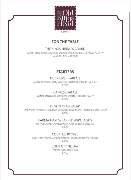 The Old Kings Head menu board displaying starters and nibbles in Kirton, featuring duck liver parfait, caprese salad, and