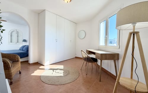 Bright studio at Villa Alegria B&B in Cala d'Or with modern desk, wardrobe, and sea views