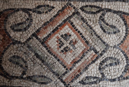 Ancient Roman mosaic with geometric patterns at Cristallo Apartment in Ravenna, Italy