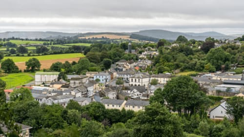 Aerial view of Madelines Accommodation in Wicklow with rolling countryside, green fields and mountains
