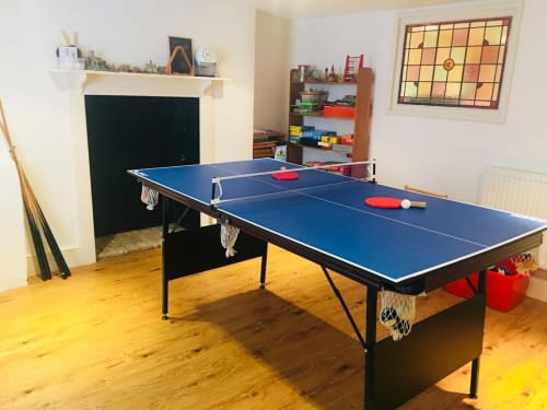 Blue ping pong table in games room at 2 Doves Holiday Property, Exeter