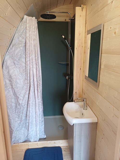 Compact bathroom in Pod Houx at La Maison de Dun, Saint Racho with shower, sink, mirror