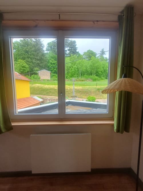 Large windows with garden view from OAK Familial room at La Maison de Dun B&B in Saint Racho, France