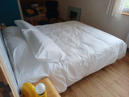 White duvet and pillows on bed at La Maison de Dun B&B, Chambre Soleil Bleu room in Saint Racho, France