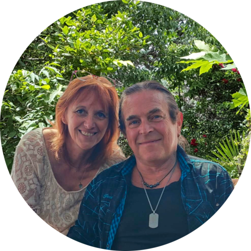 Smiling hosts at Le Portel des Arnaud B&B in Durfort-et-Saint-Martin-de-Sostenac, France, with lush garden backdrop