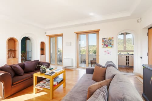Spacious living room at Terrestre Roma apartment Casa Flaminio in Roma with city views, modern furnishings and wooden floors