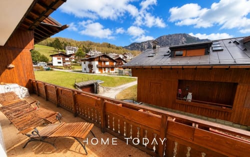 Wooden alpine chalet with mountain views and furnished balcony in Cortina d'Ampezzo, Italy