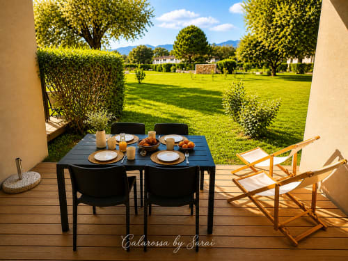 Terrace dining setup at Calarossa by Sarai with garden views, Lecci, Tuscany