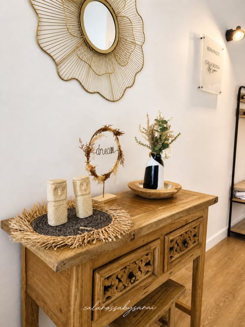 Styled wooden console with decorative accents at Calarossa By Sarai apartment in Lecci