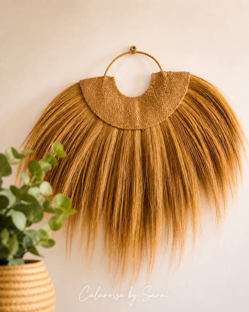 Boho straw hanging decoration with textured handle at Calarossa by Sarai apartment, Lecci