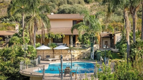 Dimora Silva Nature Suites villa with private pool, surrounded by palm trees and lush gardens in San Martino delle Scale,