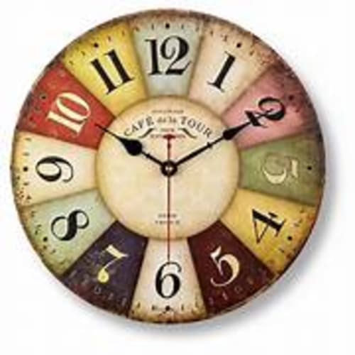 Vintage clock face with colorful segments at Les Gites De Petrocoriis, Boulazac hotel
